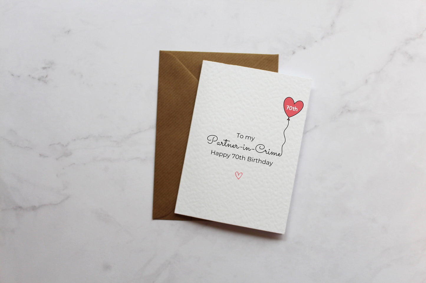 a card with a heart balloon on it