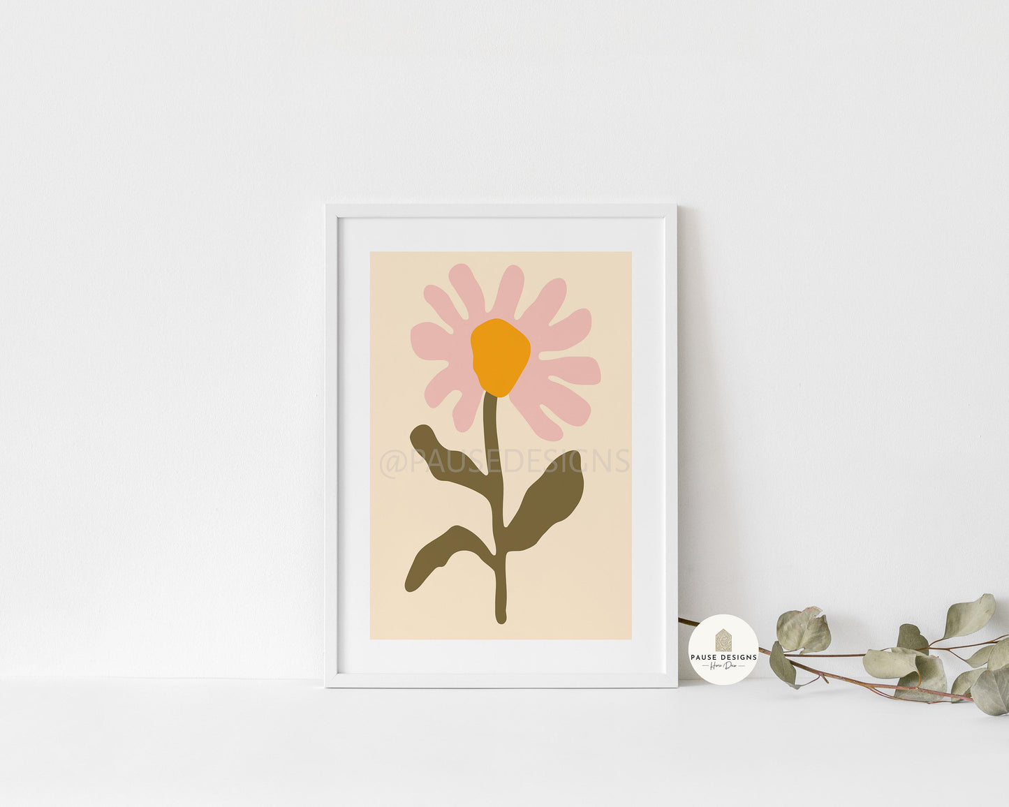 a picture of a flower on a shelf