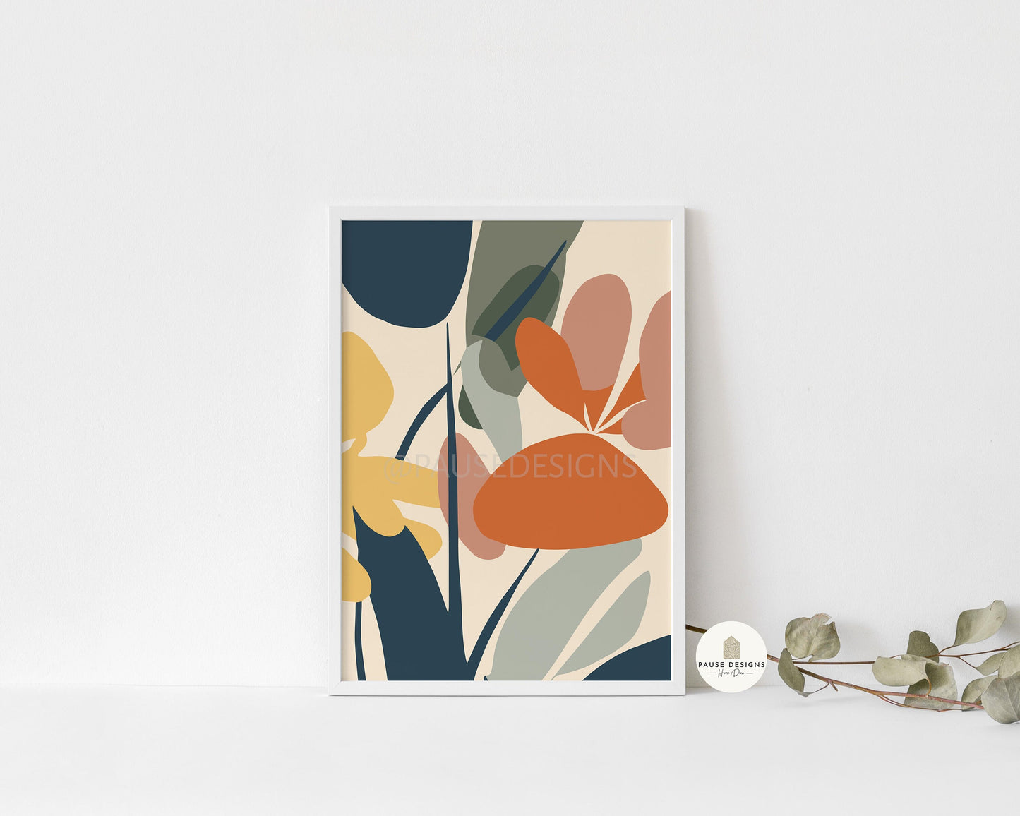 a picture of a flower on a shelf