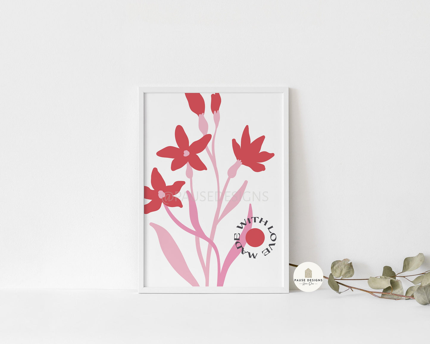 a picture of some red flowers on a white shelf