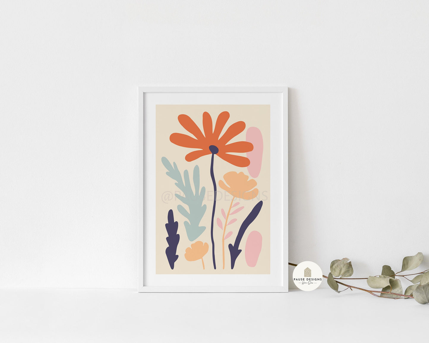 a picture of a flower on a shelf