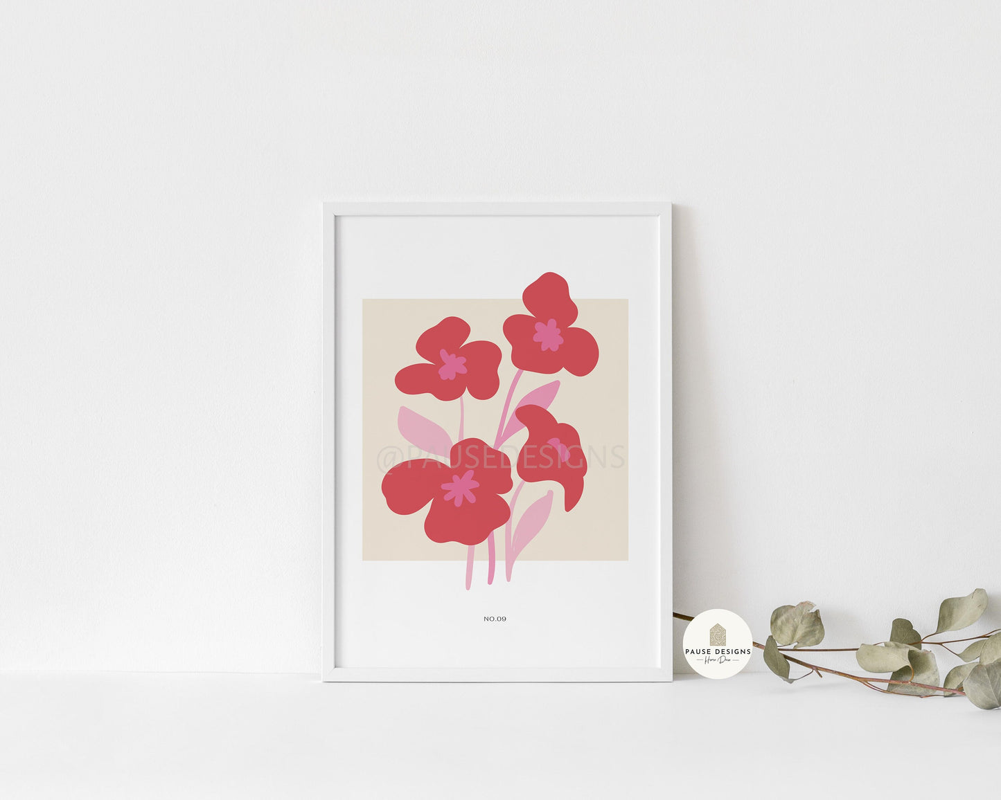 a picture of some red flowers on a shelf