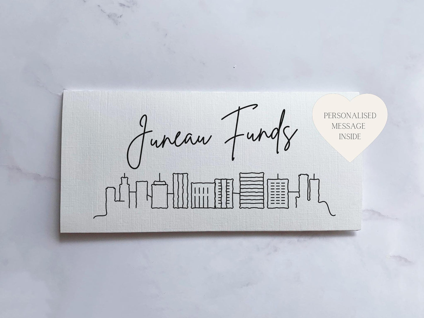 a business card with a city skyline on it