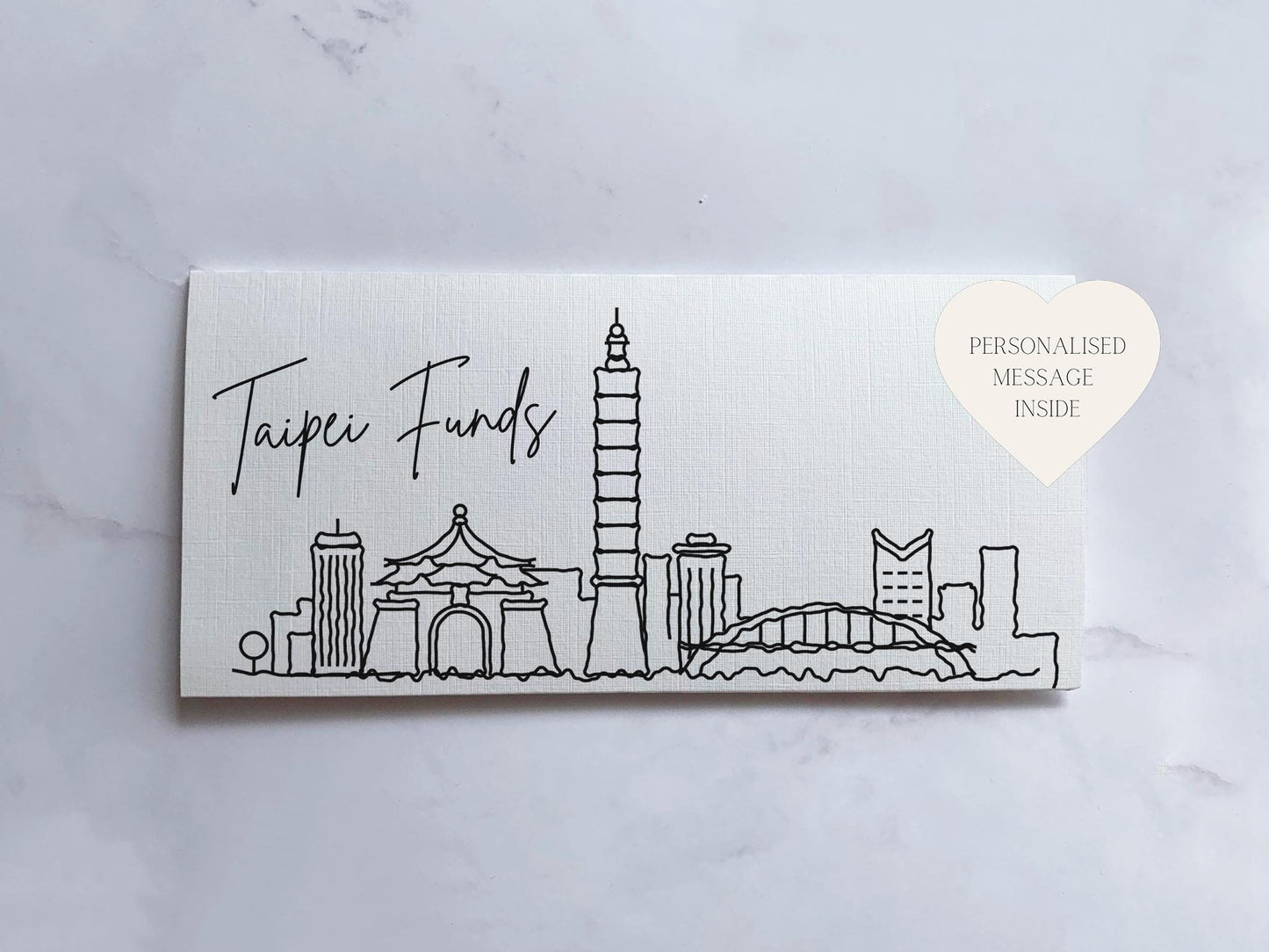 a white card with a drawing of a city