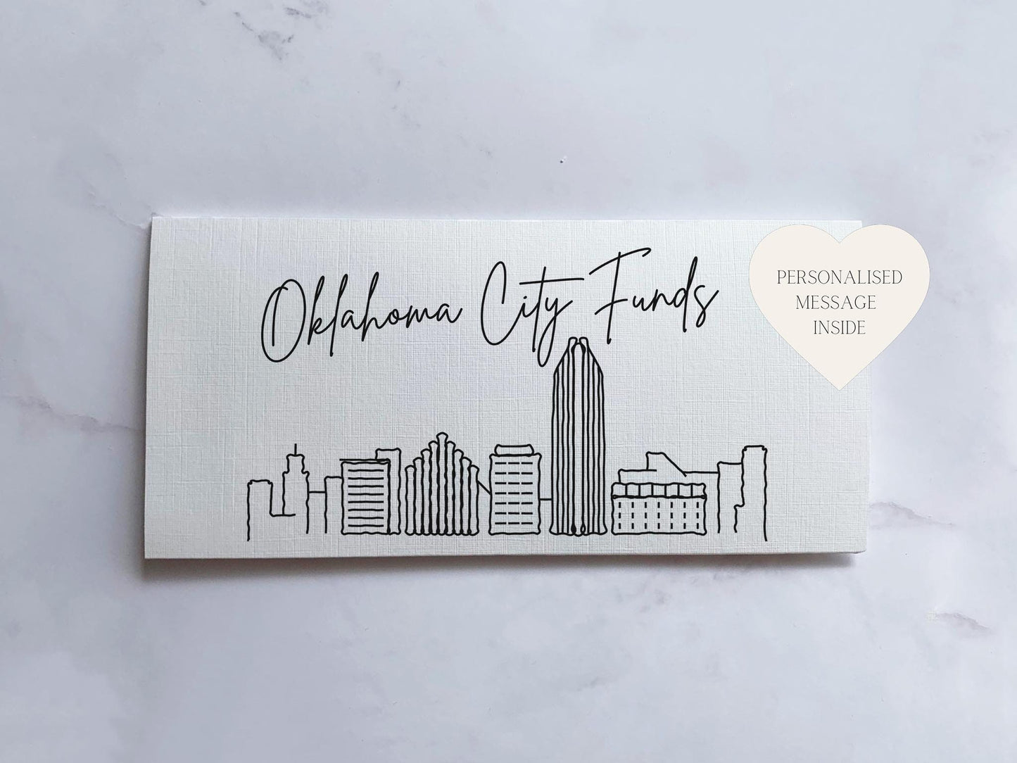 a business card with a city skyline drawn on it