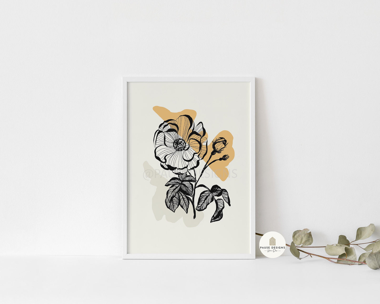 a picture of a flower on a white wall