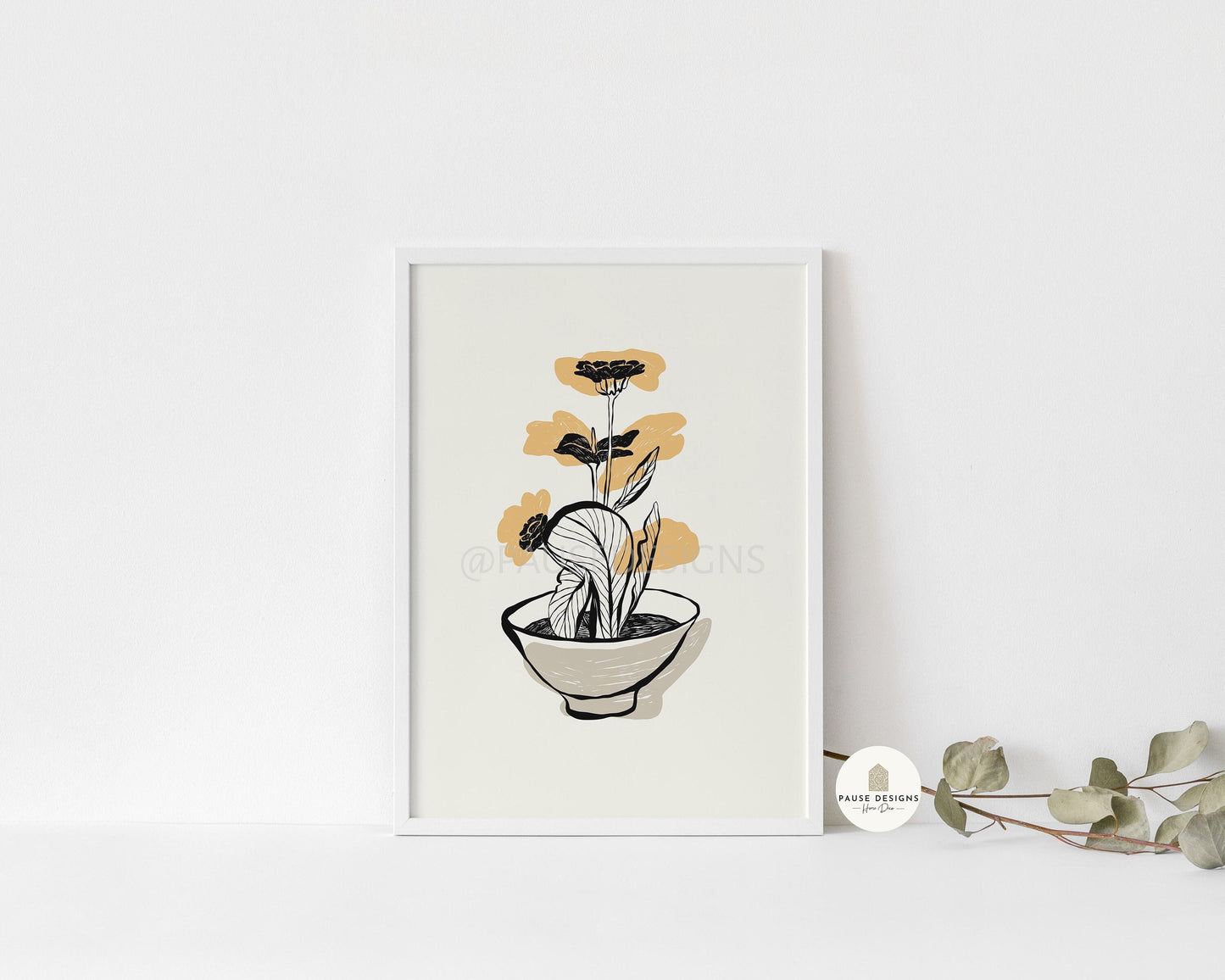 a picture of a plant in a bowl on a shelf