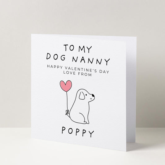 a card with a dog holding a heart balloon