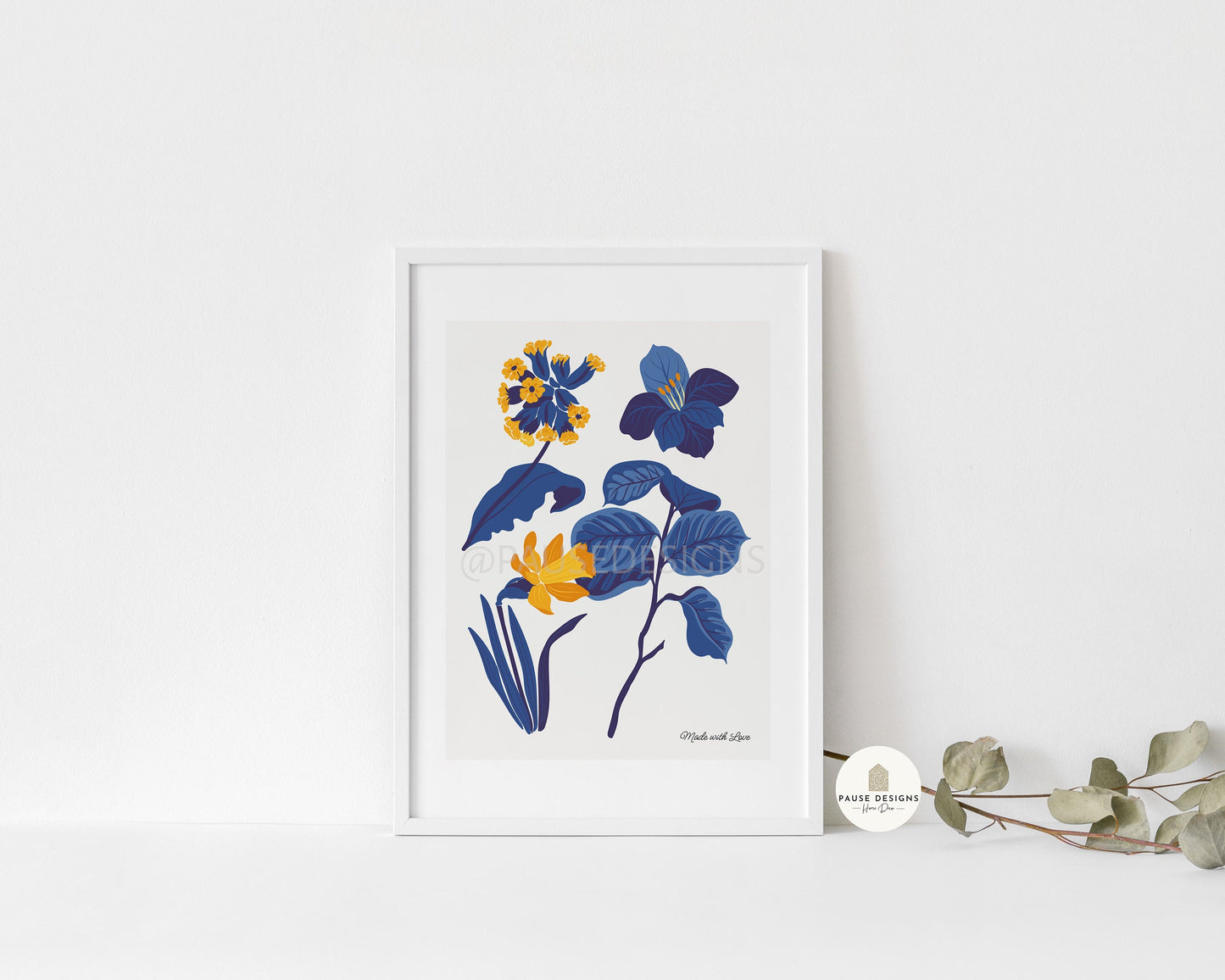 a picture of blue and yellow flowers in a white frame