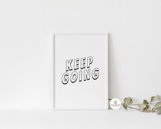 a picture of a white frame with the words keep going printed on it