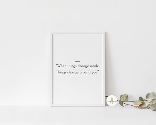 a picture frame with a quote on it next to a plant