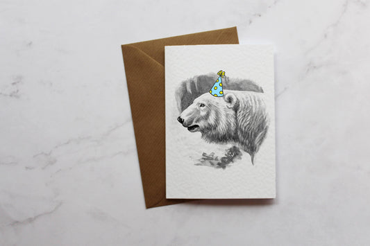 a card with a picture of a polar bear wearing a birthday hat