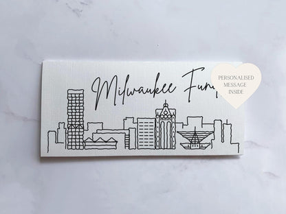 a business card with a picture of a city