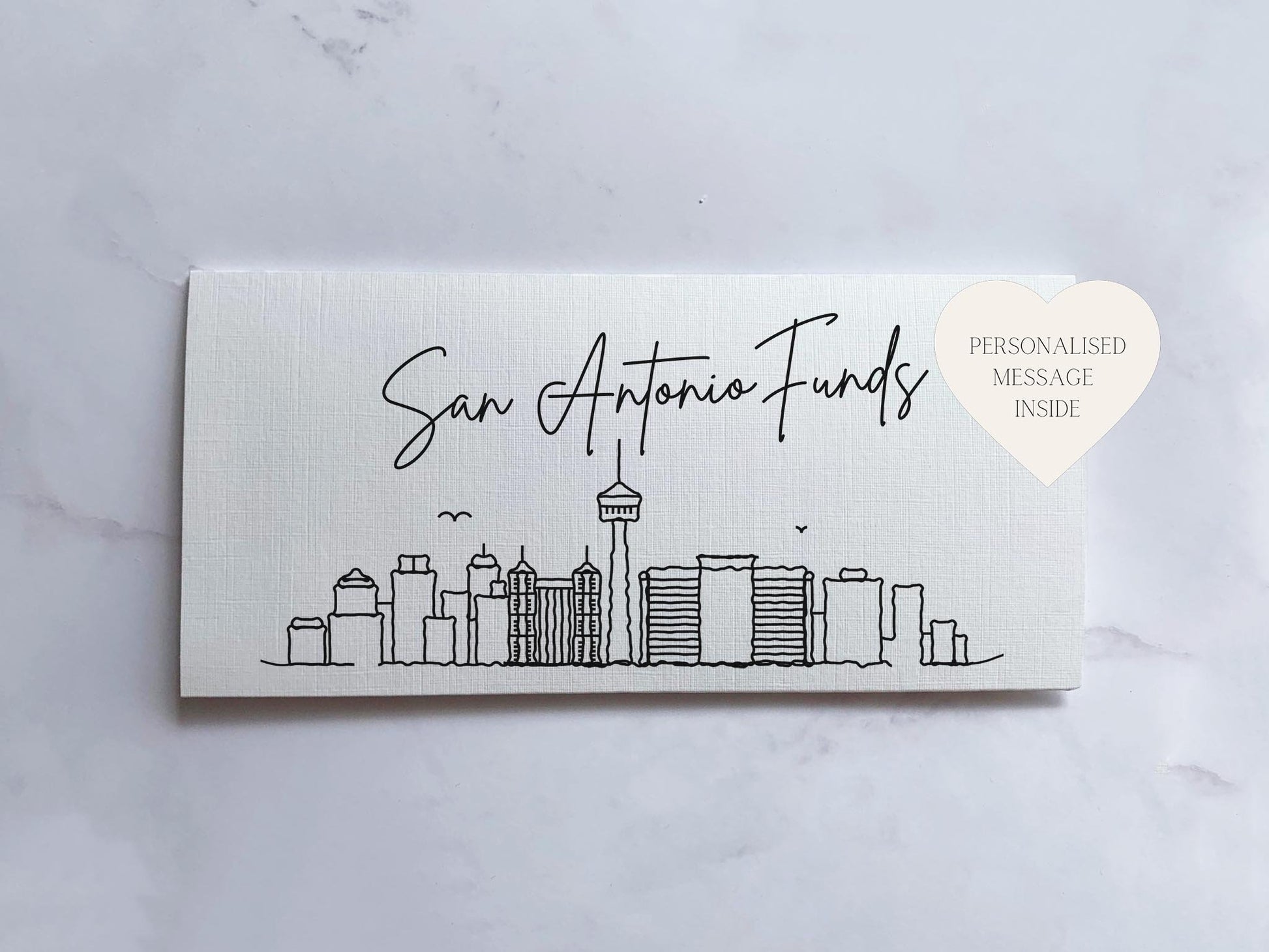 a white business card with a picture of a city