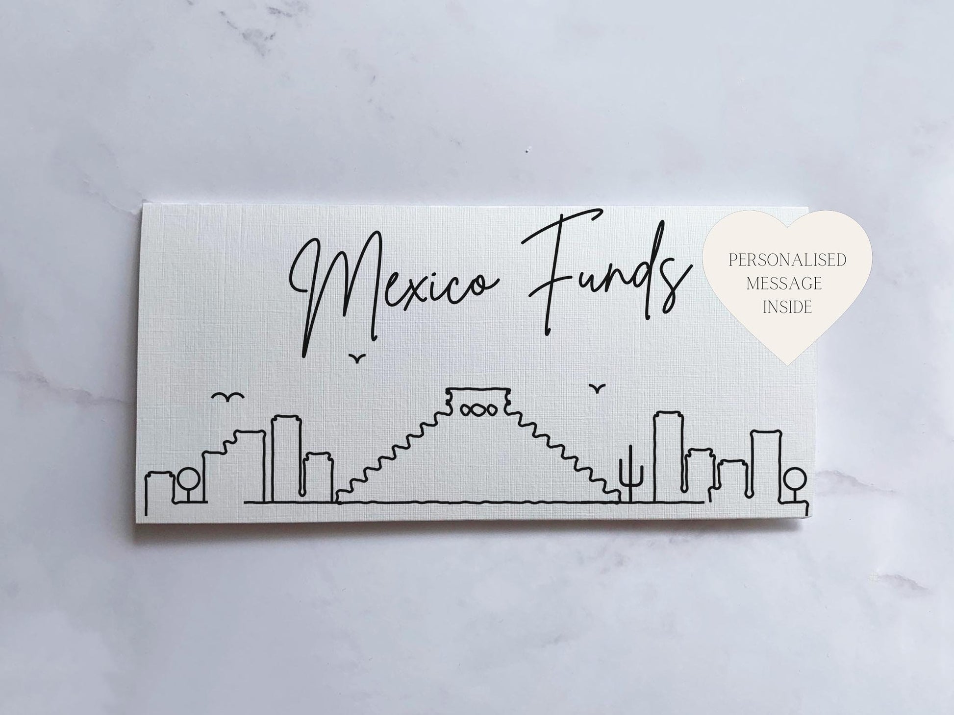 a white business card with a city skyline on it