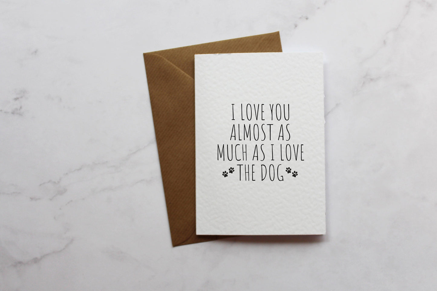 a card with the words i love you almost as much as i love the dog